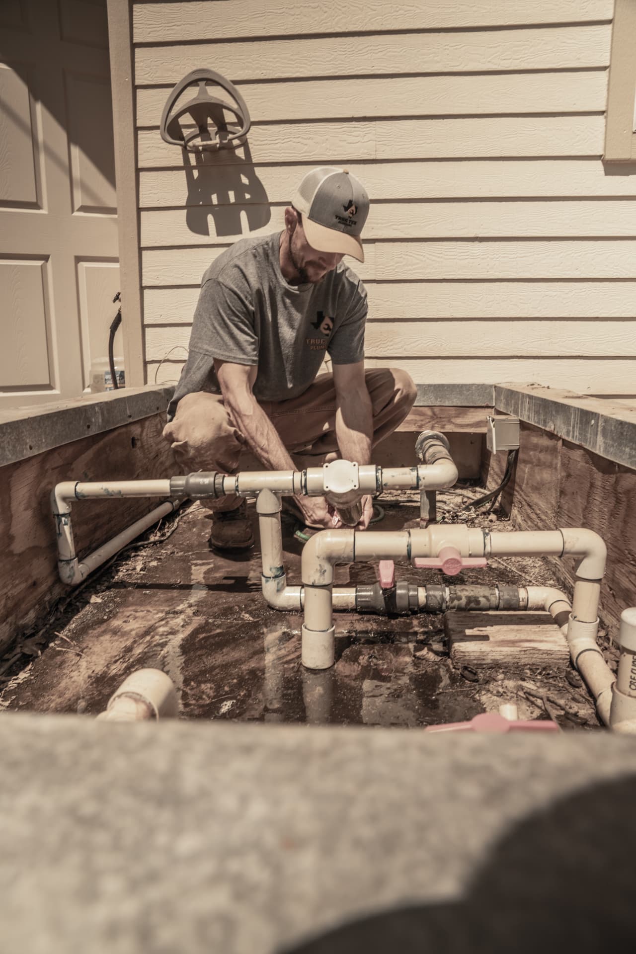 True Tex plumber repiping water lines at a job site