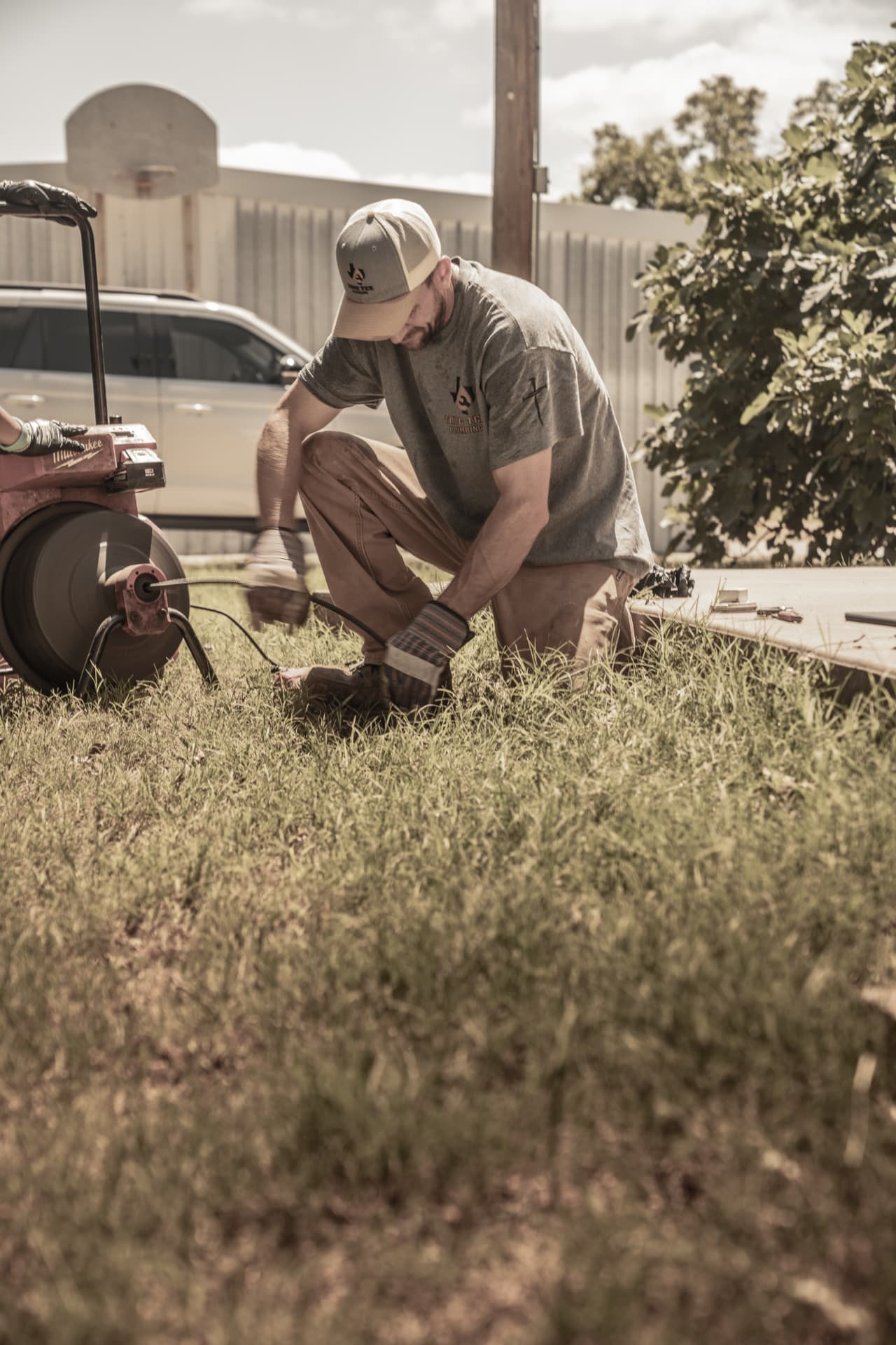 True Tex technician setting up a drain cleaning machine