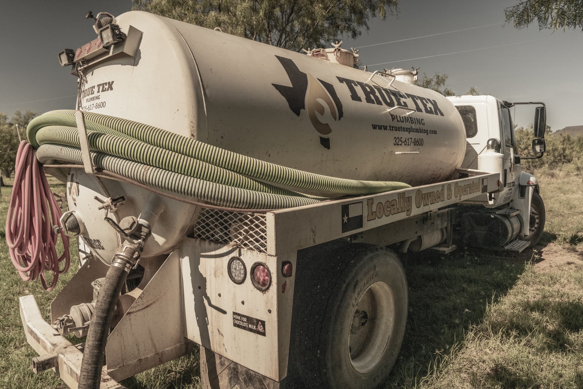 True Tex septic pump truck parked on a rural job site