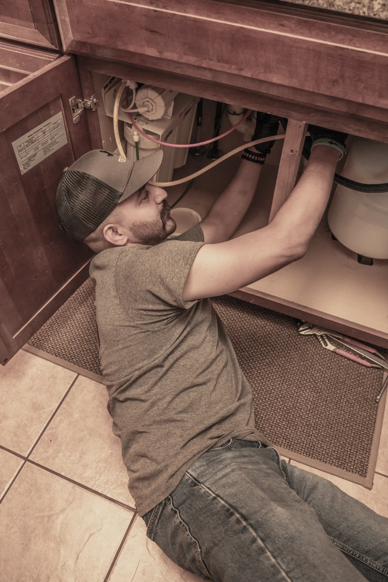 True Tex technician installing an under-sink reverse osmosis system